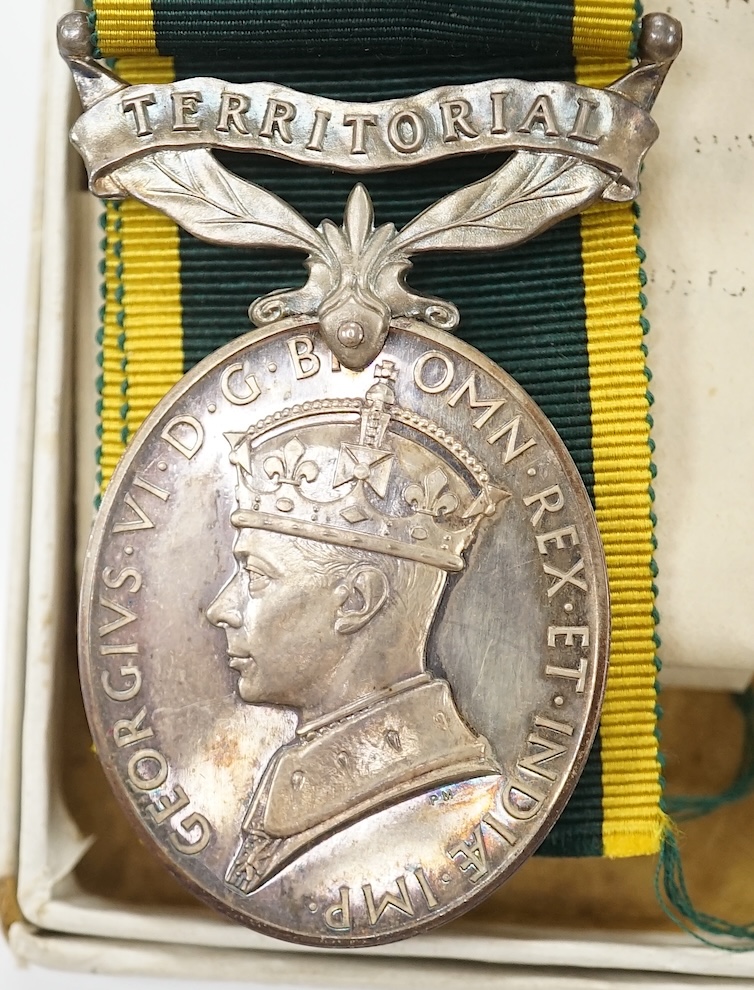 A collection of military interest medals and cloth badges to include a 1914-1918 medal awarded to Lieut. W. C. Griffith and an unnamed 1910-1935 medal. Condition - varies